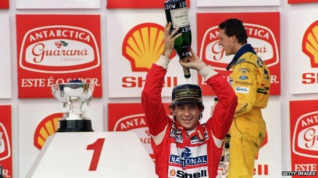 Brazilian Formula One driver Ayrton Senna pours champagne over himself on 28 March, 1993 celebrating his victory in the Brazilian Grand Prix, Sao Paulo. This was Senna's 37th Grand Prix victory, but only his second win in Brazil.