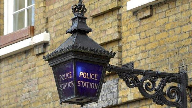 A blue lamp outside the St John's Wood police station, in London