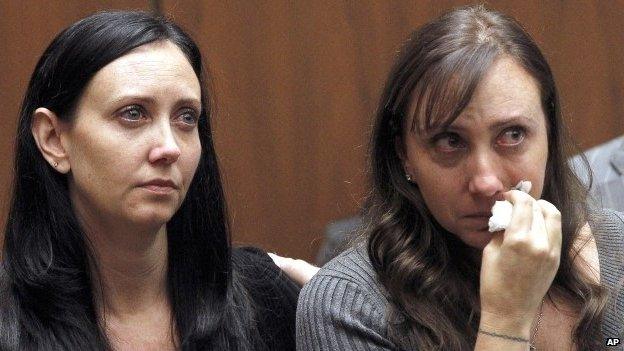 Evin Collins (left) and Bonnie Stow, sisters of beating victim Bryan Stow, in court in Los Angeles on 20 February 2014