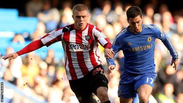 Jake Bidwell challenges Chelsea's Eden Hazard