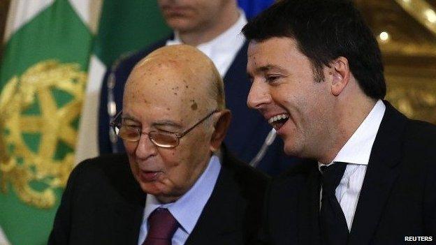 Newly appointed Italian Prime Minister Matteo Renzi (R) talks with Italian President Giorgio Napolitano during the swearing in ceremony for 16 new ministers at Quirinale palace in Rome February 22, 2014