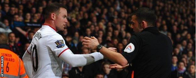 Wayne Rooney and referee Michael Oliver