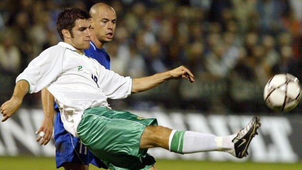 Northern Ireland's Aaron Hughes battles with Greece's Stelios Giannakopoulos in the last meeting between the sides in October 2003