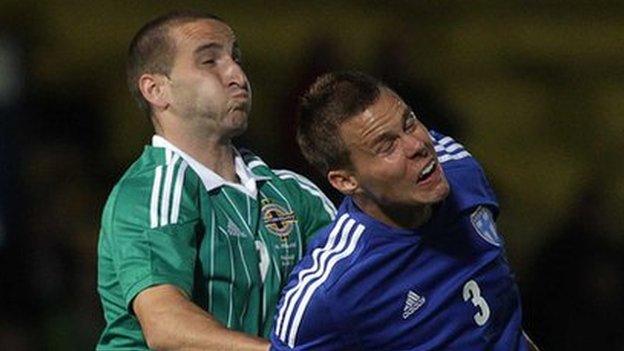 Martin Paterson battles with Finland's Niklas Moisander in the 2012 friendly at Windsor Park