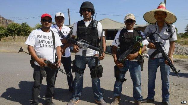 Members of a "self-defence group" pose for a picture in Antunez, Michoacan state, on 15 February, 2014