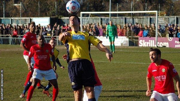 Tim Sills of Gosport Borough heads clear against Havant and Waterlooville