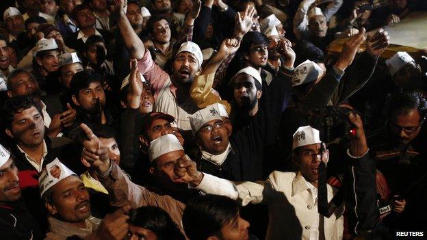 Supporters of Arvind Kejriwal, chief of the Aam Aadmi (Common Man) Party (AAP), shout slogans before he announced his resignation as Delhi's chief minister at the party headquarters in New Delhi 14 February 2014.