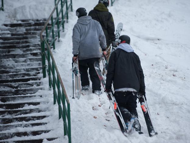 Khai Krepela, Logan Imlach and Snady Boville walking next to a rail in St Paul, Minnesota