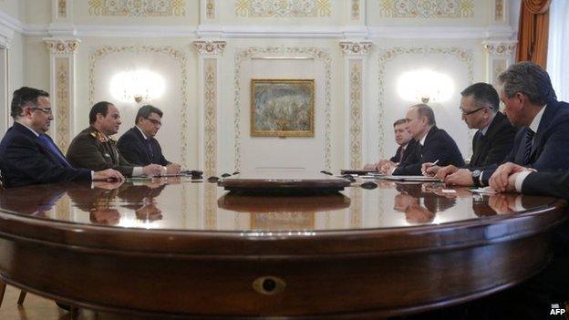 Egyptian army chief Abdel Fattah al-Sisi (2nd L) and Egypt's Foreign Minister Nabil Fahmy (L) speak with Russian President Vladimir Putin (3rd R) during their talks meet in Novo-Ogaryovo, outside Moscow, on February 13, 2014, with Russian Defence Minster Sergei Shoigu (R) attending the talks.