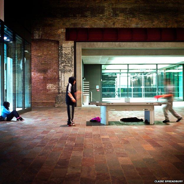 People playing table tennis