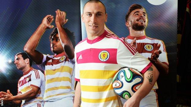 Scotland captain Scott Brown models the new away kit