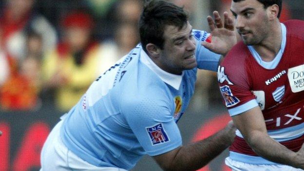 Leicester's Jerome Schuster, in his Top 14 days with Perpignan, tackles Racing Metro full-back Juan Imhoff