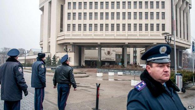 Police officers guard the parliament building