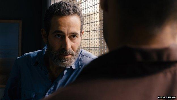 The character, Omar (Adam Bakri) speaks to an Israeli intelligence agent played by Waleed Zuaiter