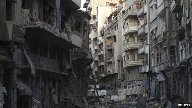 Damaged buildings are pictured in the besieged area of Homs 22 February 2014