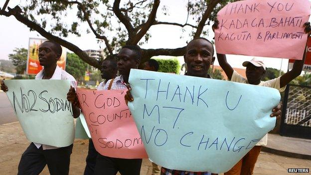 Anti-gay supporters celebrate after Uganda's President Yoweri Museveni signed a law imposing harsh penalties for homosexuality in Kampala February 24, 2014.