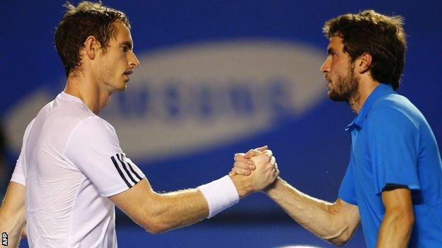 Andy Murray (left) shakes hands with Gilles Simon