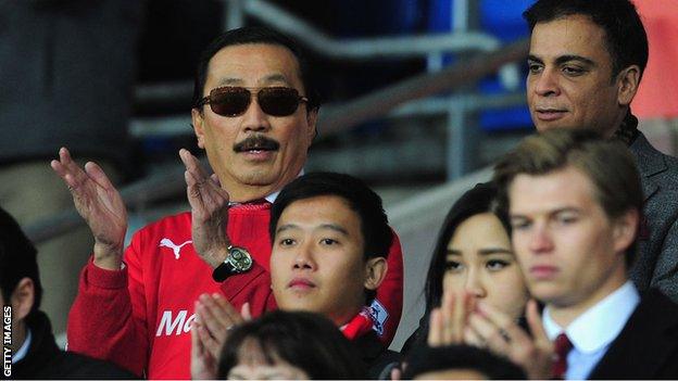 Vincent Tan in a red Cardiff City shirt