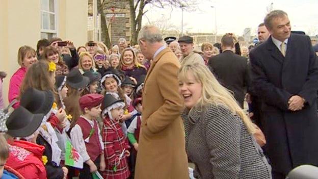 Prince Charles shares a joke with onlookers