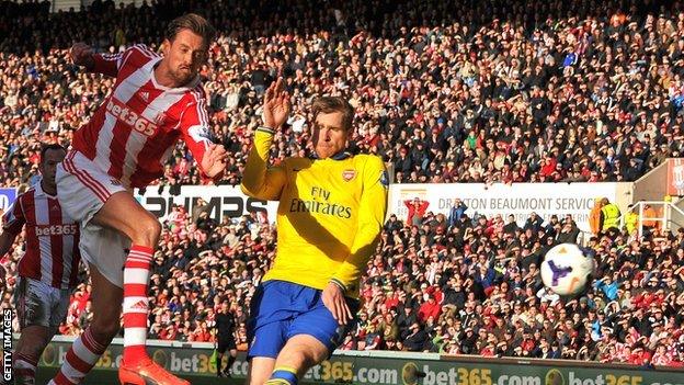 Stoke City striker Peter Crouch has an attempt during the game against Arsenal