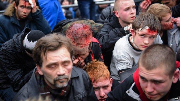 Pro-Western activists, some wounded, after clashes with pro-Russian activists in Kharkiv, Ukraine, on 1 March 2014