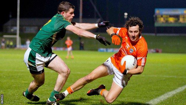 Jamie Clarke is tackled by Donal Keoghan at Pairc Tailteann