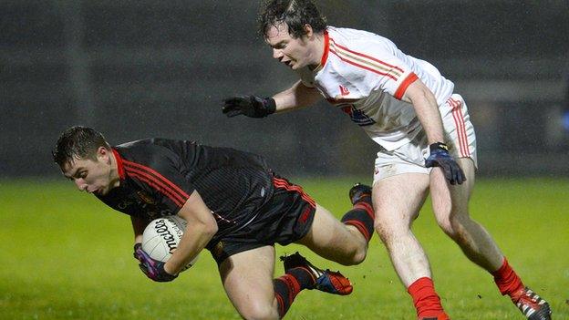 Down's Ryan Boyle wins possession ahead of Louth's Colm Judge