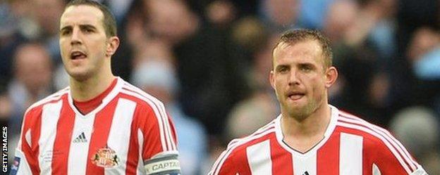 Sunderland's John O'Shea and Lee Cattermole after the Capital One Cup final with Manchester City