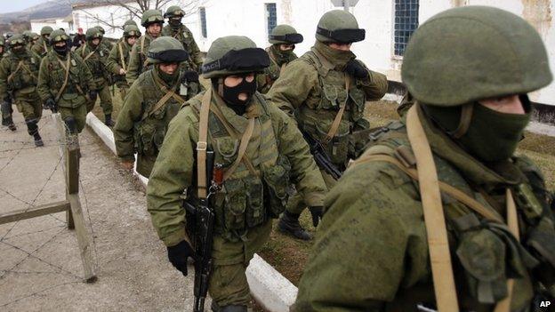 Unidentified troops surround a Ukrainian military base in Crimea. 2 March 2014