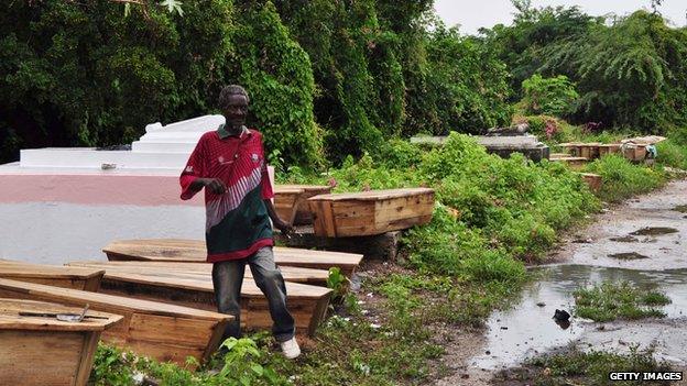 Caskets of victims of the violence in Kingston are left in the May Pen Cemetery of the Jamaican capital on 28 May, 2010.