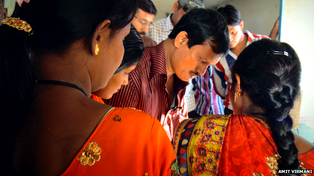 Muruganantham trains a group of women