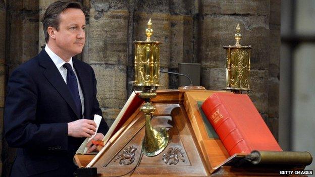 David Cameron stands at the lectern for his Bible reading during a National Service of Thanksgiving to celebrate the life of Nelson Mandela