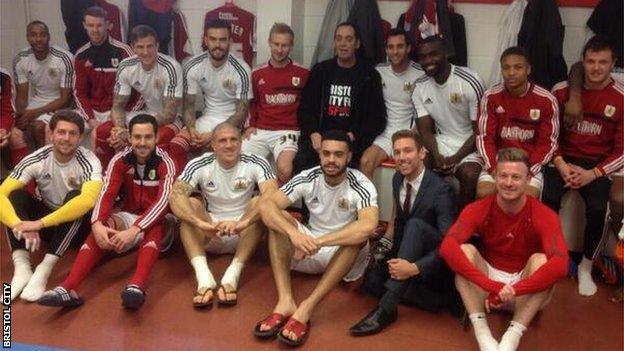 Bristol City fan Mark Saunders (back, centre) with the team