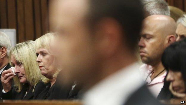 June Steenkamp (left), the mother of Reeva Steenkamp, wipes her face with a tissue at the start the trial of Oscar Pistorius at the high court in Pretoria - 3 March 2013