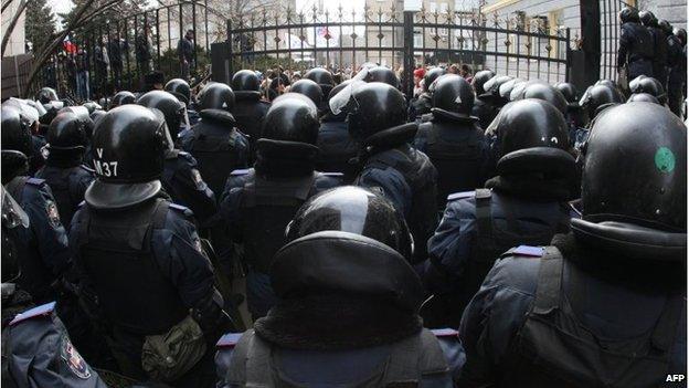 Riot policemen stand guard in front of the regional administration in Donetsk on March 3