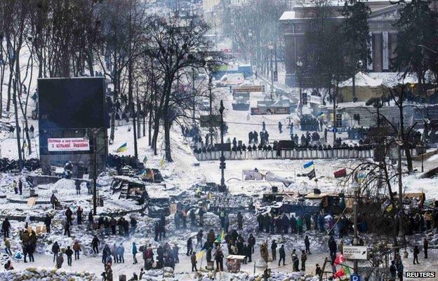 Riot police and protesters face off in Independence Square