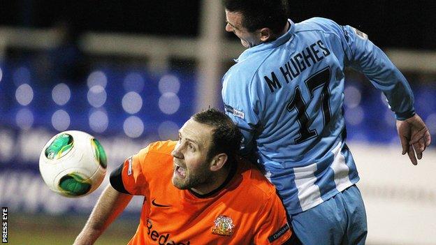 Glenavon striker Guy Bates comes under pressure from Michael Hughes