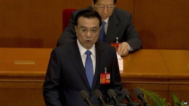 Chinese Premier Li Keqiang delivers a work report during the opening session of the annual National People's Congress in Beijing's Great Hall of the People, China, 5 March 2014