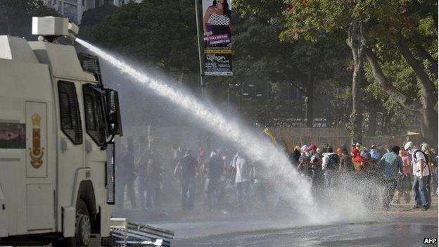 A water cannon is fired at protesters in Caracas on 4 March, 2014