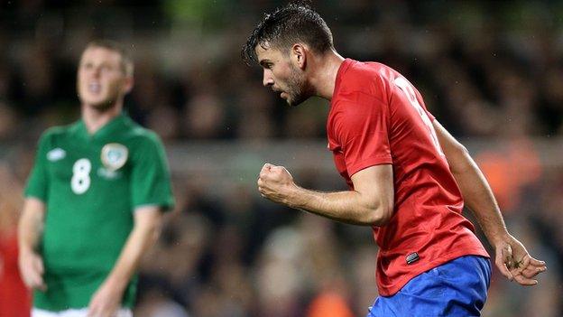Filip Dordevic celebrates his Serbia winner as James McCarthy's shows his disappointment in the background