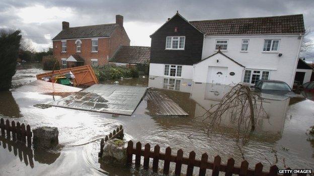 Flood water continues to surround properties in the largely evacuated village of Moorland on the Somerset Levels on February 18