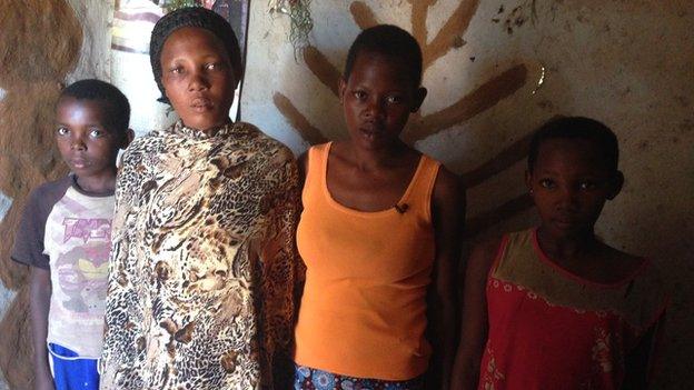 Sulaina with her mother and younger brother and sister in her village of Serinya in rural Central Uganda