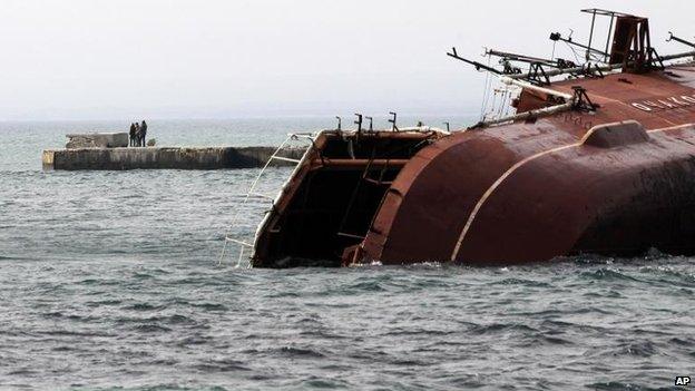 Russian seamen scuttle the Russian anti-submarine ship Ochakov outside the Crimean town of Myrnyi to block the exit of Ukrainian naval vessels, 6 March