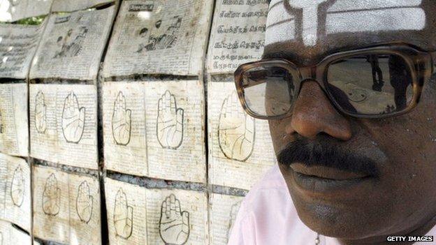 A palm reader and posters advertising his services
