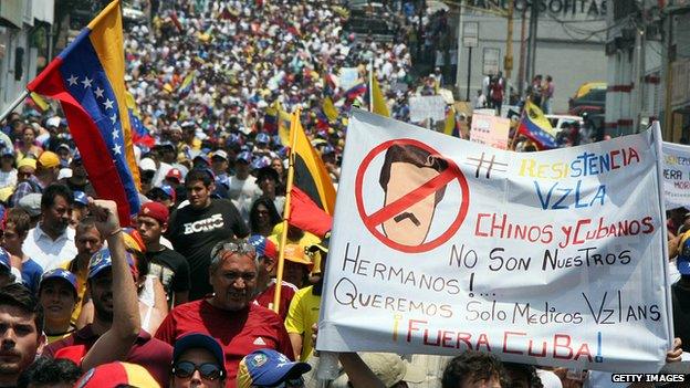 Opposition activists march during a protest against the government of Venezuelan President Nicolas Maduro in San Cristobal on 5 March 2014