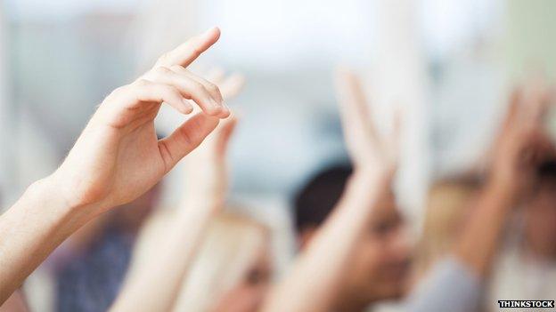 Hands up in a classroom