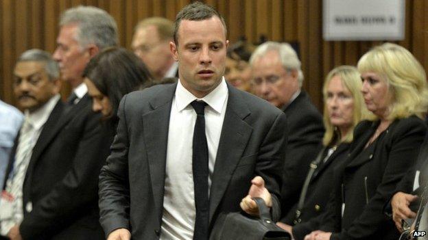 Oscar Pistorius arrives for the opening day of his murder trial