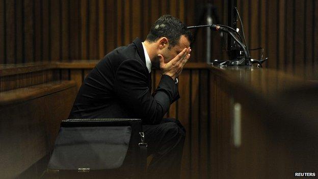 Oscar Pistorius reacts to part of the evidence on the fourth day of his trial