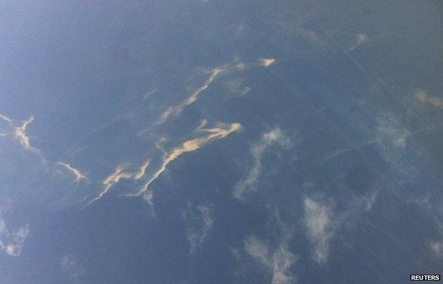 An aerial view of an oil spill is seen from a Vietnamese Air Force aircraft searching for the missing plane