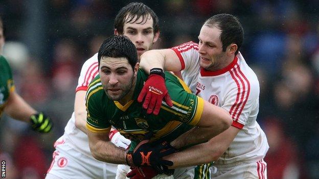 Kerry's Bryan Sheehan is tackled by Ronan McNamee and Ronan McNabb of Tyrone